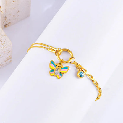 Gold-coloured titanium steel butterfly necklace and matching bracelet set on a snake bone chain.