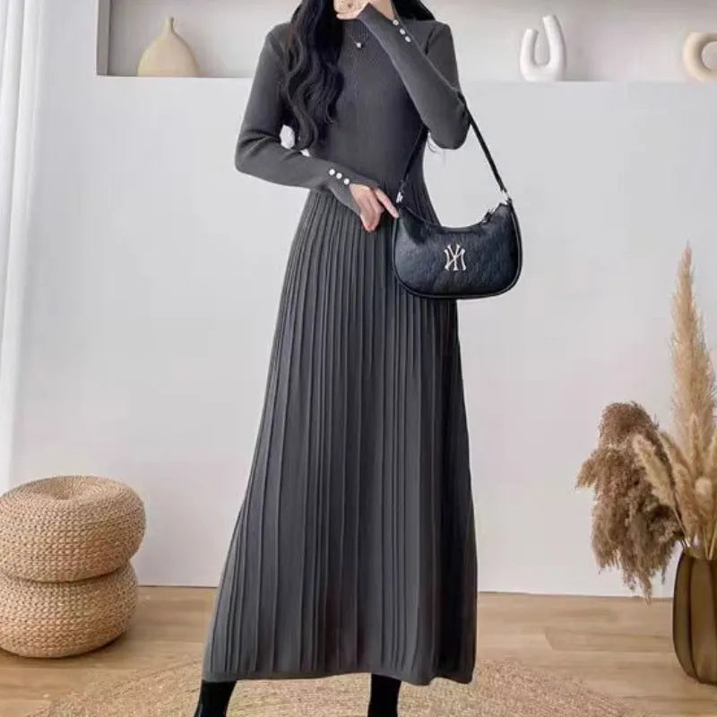 Women's beige high-waisted A-line pullover dress with a knitted texture, midi length.