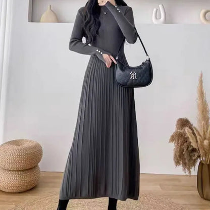 Women's beige high-waisted A-line pullover dress with a knitted texture, midi length.