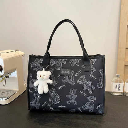 Women's black and white soft canvas tote bag with large capacity and printed rhombus pattern on front.