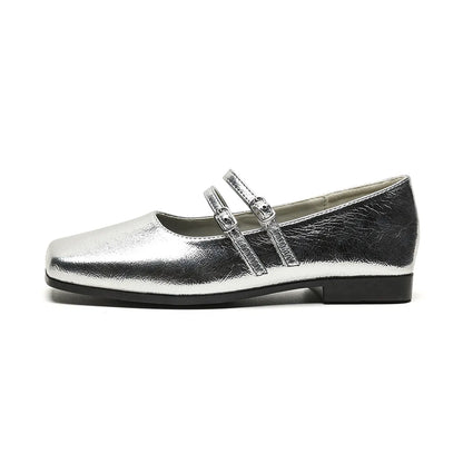 Women's silver genuine sheepskin Mary Jane ballet flats with an adjustable cross-buckle strap on the instep.