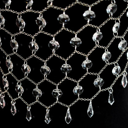 Clear acrylic crystal sequins body chain draped as a chest necklace.