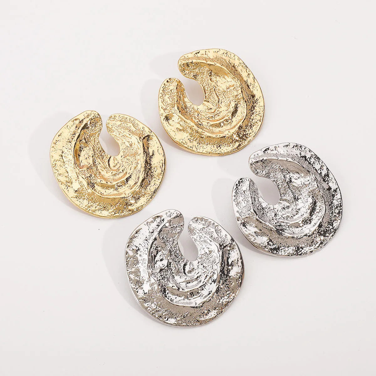Geometric women's earrings with irregular pleating and concave-convex texture in gold colour