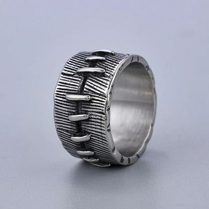 Dark geometric titanium steel punk ring showing U-shape and double ring design with stitched texture.