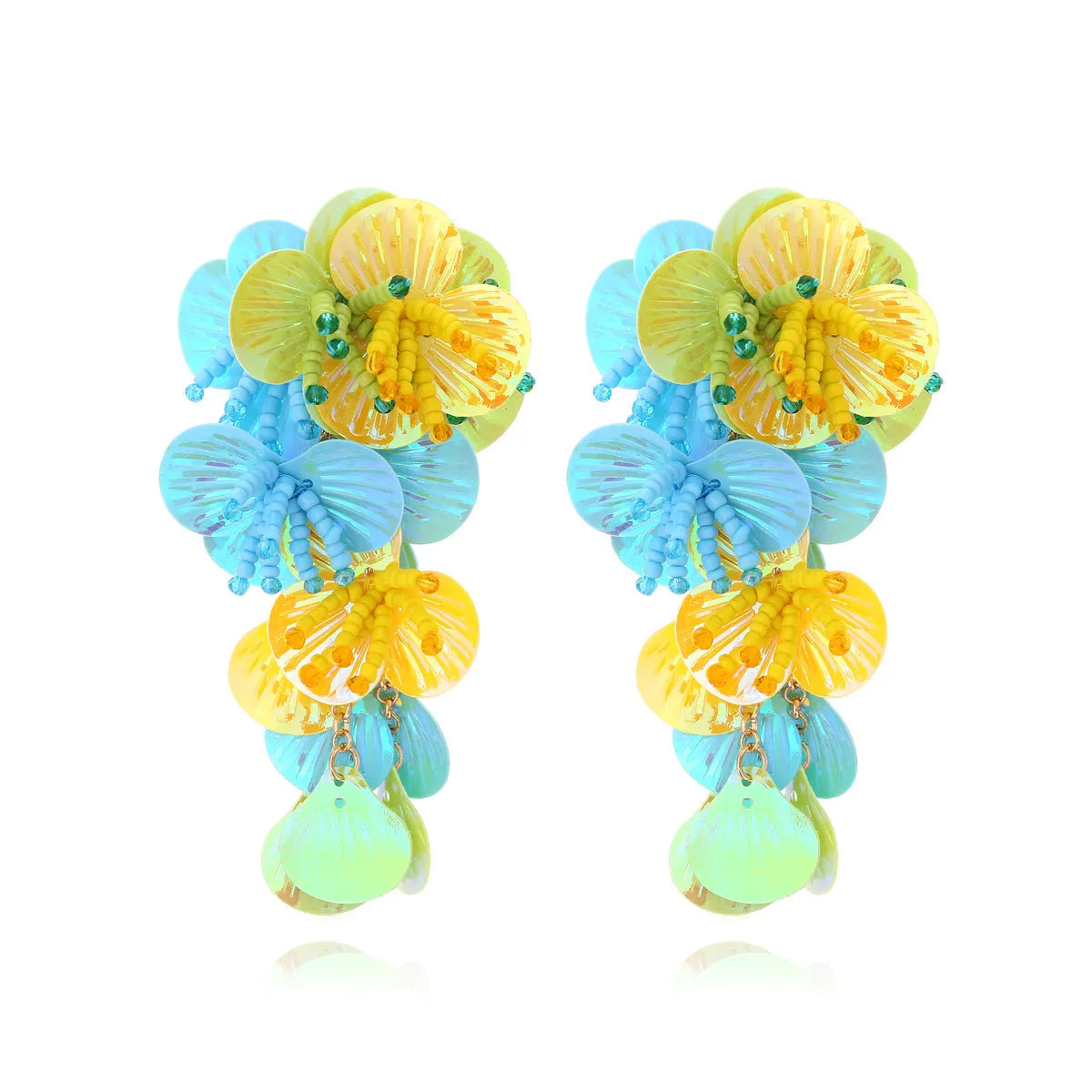 Handmade string bead flower earrings with exaggerated floral shapes in rose and purple colours, showing mixed materials and nickel-free hooks
