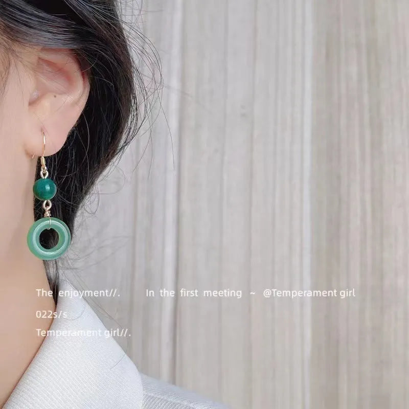 Pair of green geometric peace buckle earrings with Chinese cheongsam design inspiration