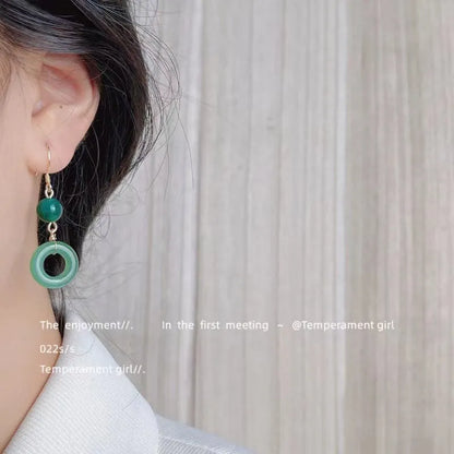 Pair of green geometric peace buckle earrings with Chinese cheongsam design inspiration