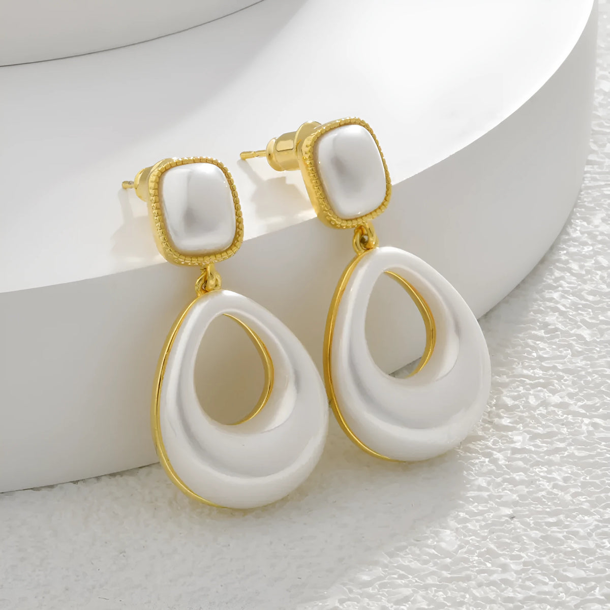 Gold drop earrings with imitation mabe pearl component and 14K gold plating
