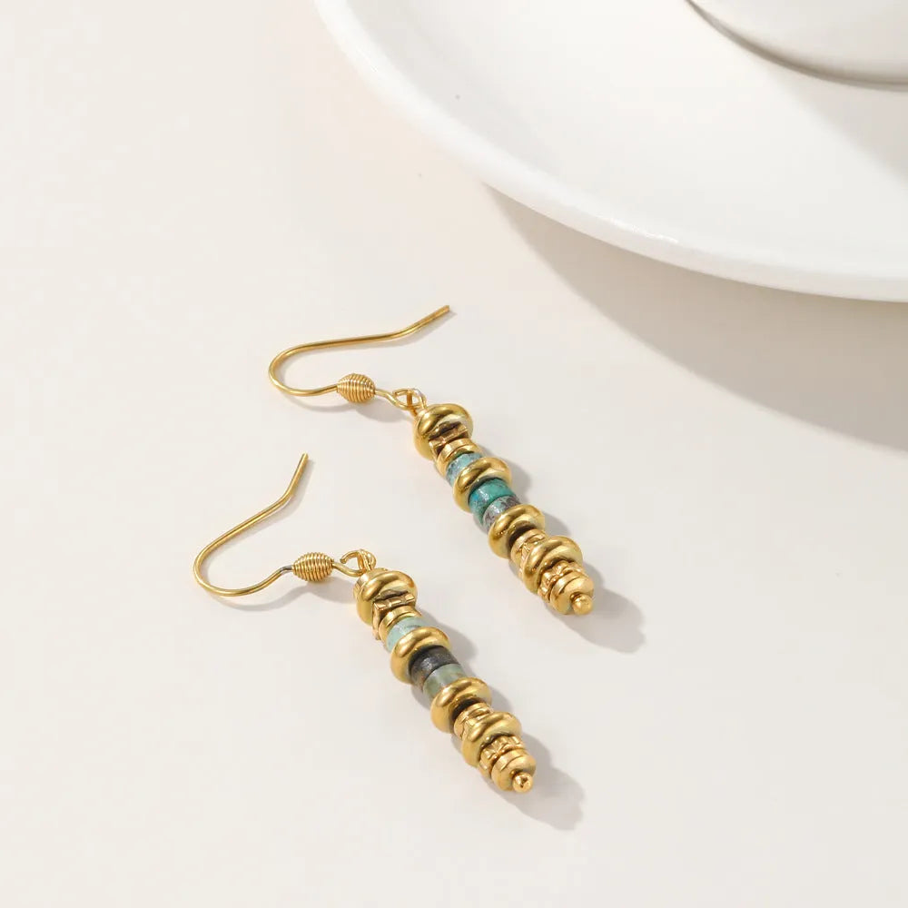Geometric titanium steel dangle earrings with 18K gold plating on a white background.