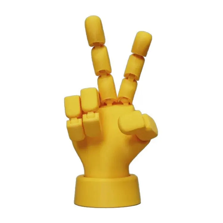 Yellow movable joint hand ornament showing articulated design and 5*5.38*7.5cm dimensions