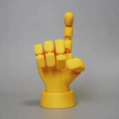 Yellow movable joint hand ornament showing articulated design and 5*5.38*7.5cm dimensions