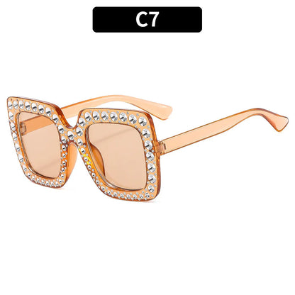 Plastic sunglasses with fashion personality styling in various colour options including black frame and transparent tea frame