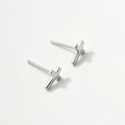 Women's gold bow cross stud earrings in zinc alloy with geometric design