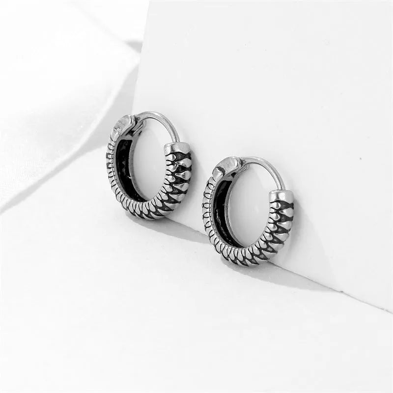 Silver retro twist earrings with geometric stripe design and round elements on stainless steel