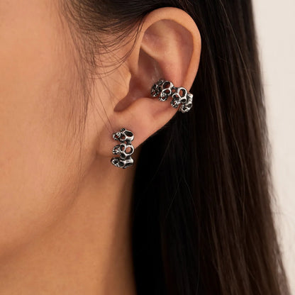 Stainless steel skull ear clip earrings with hollow geometric design and electroplated finish