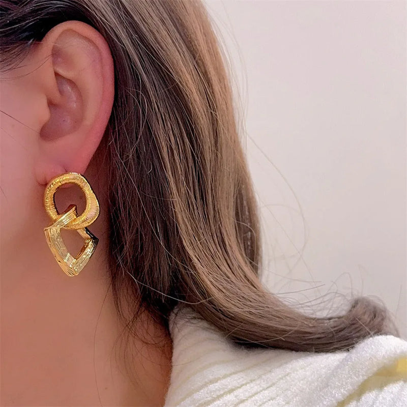 Geometry circle pendant earrings for women in copper with electroplated gold or silver finish measuring 3.4cm in height featuring a retro European and American style for a bold personality look