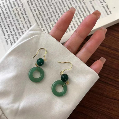 Pair of green geometric peace buckle earrings with Chinese cheongsam design inspiration