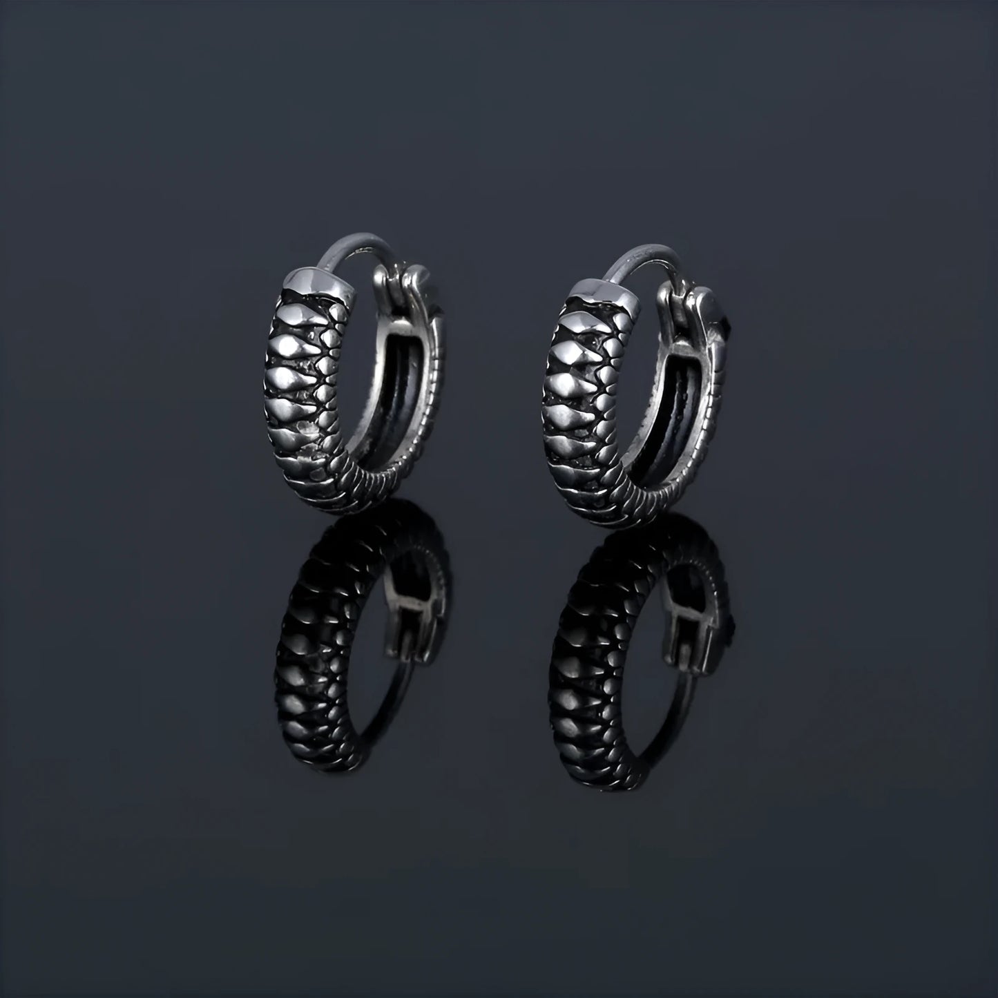 Silver retro twist earrings with geometric stripe design and round elements on stainless steel