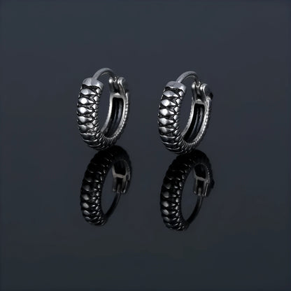 Silver retro twist earrings with geometric stripe design and round elements on stainless steel