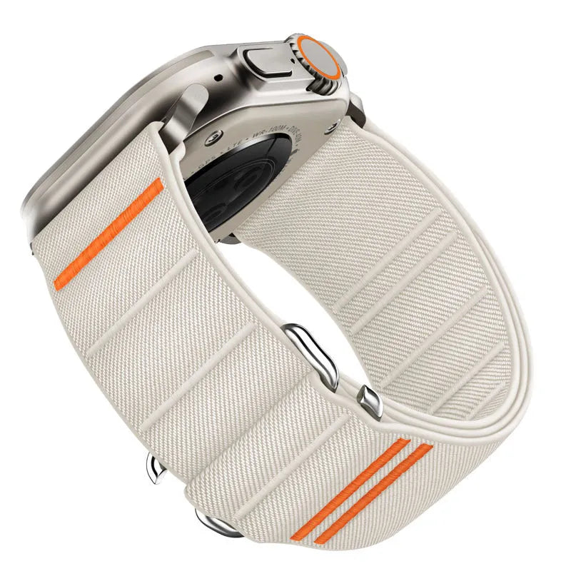 Elastic nylon Apple Watch band with stainless steel buckle shown in Army Green colour on a wrist.