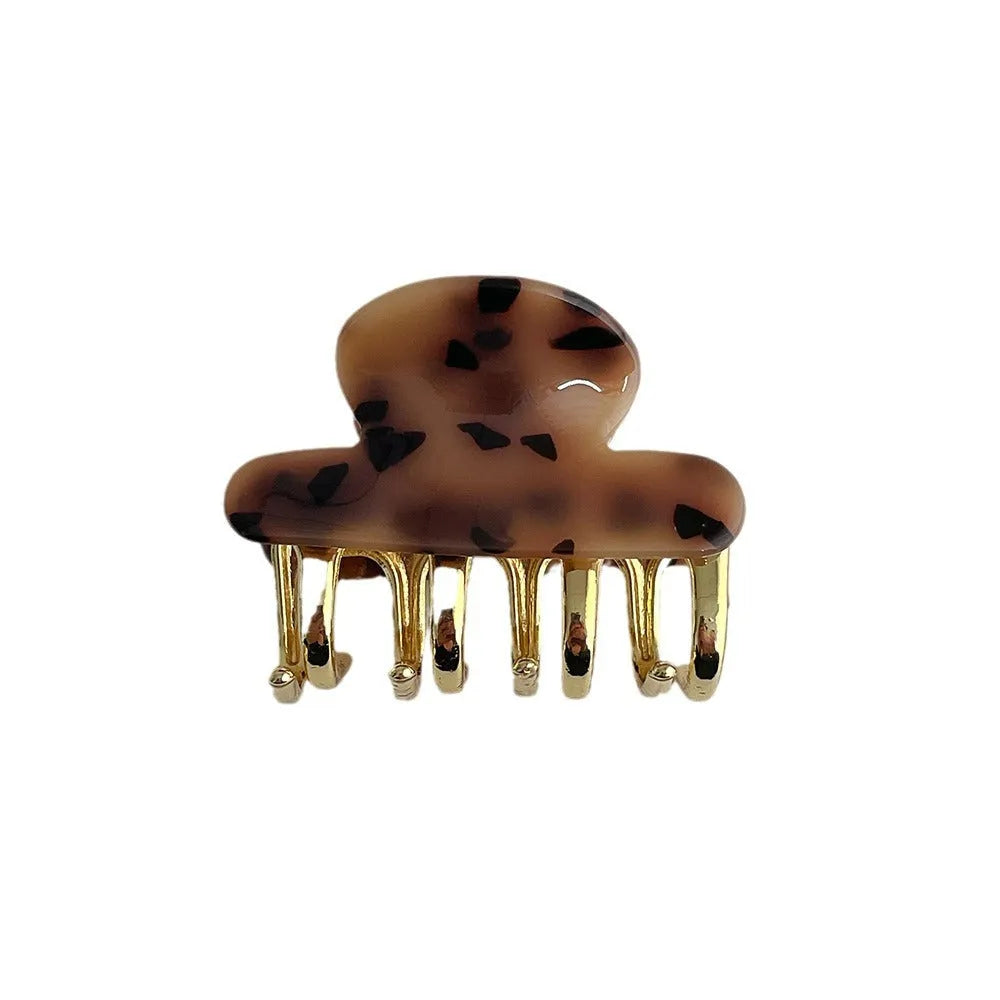 Acetate hair barrettes with metal alloy grip in leopard print, white, and ink colour options