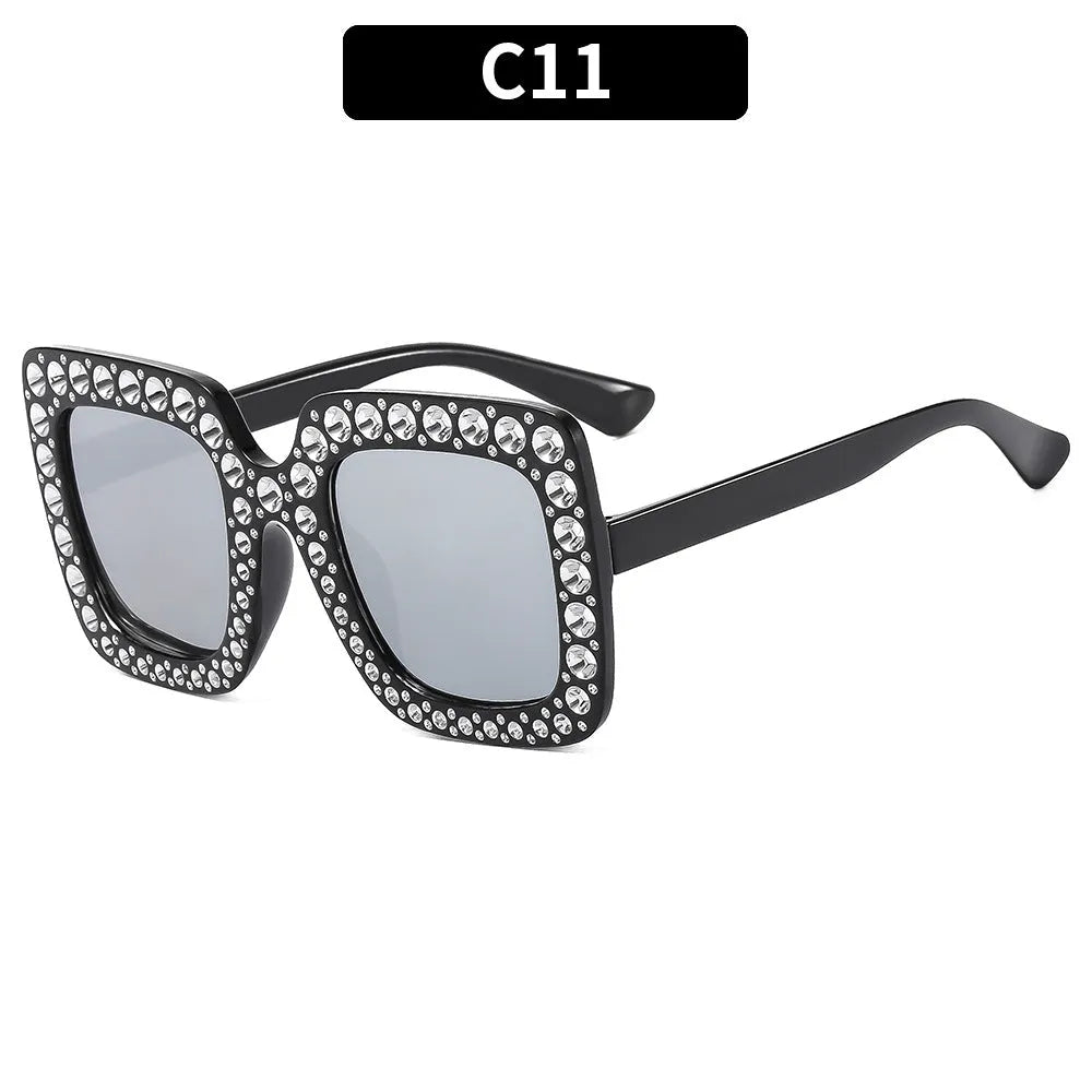 Plastic sunglasses with fashion personality styling in various colour options including black frame and transparent tea frame