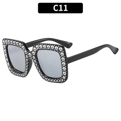 Plastic sunglasses with fashion personality styling in various colour options including black frame and transparent tea frame