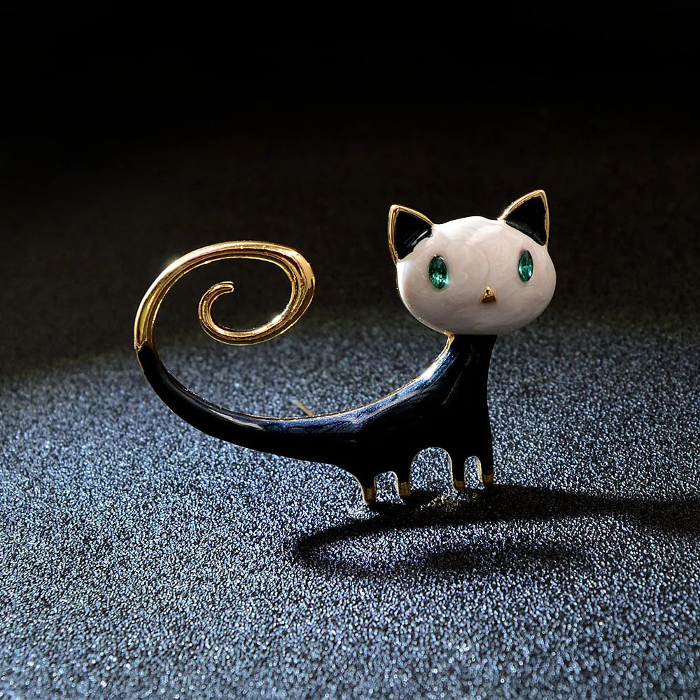 Women's alloy cat brooch with painted tailing up kitty design in white or orange colour