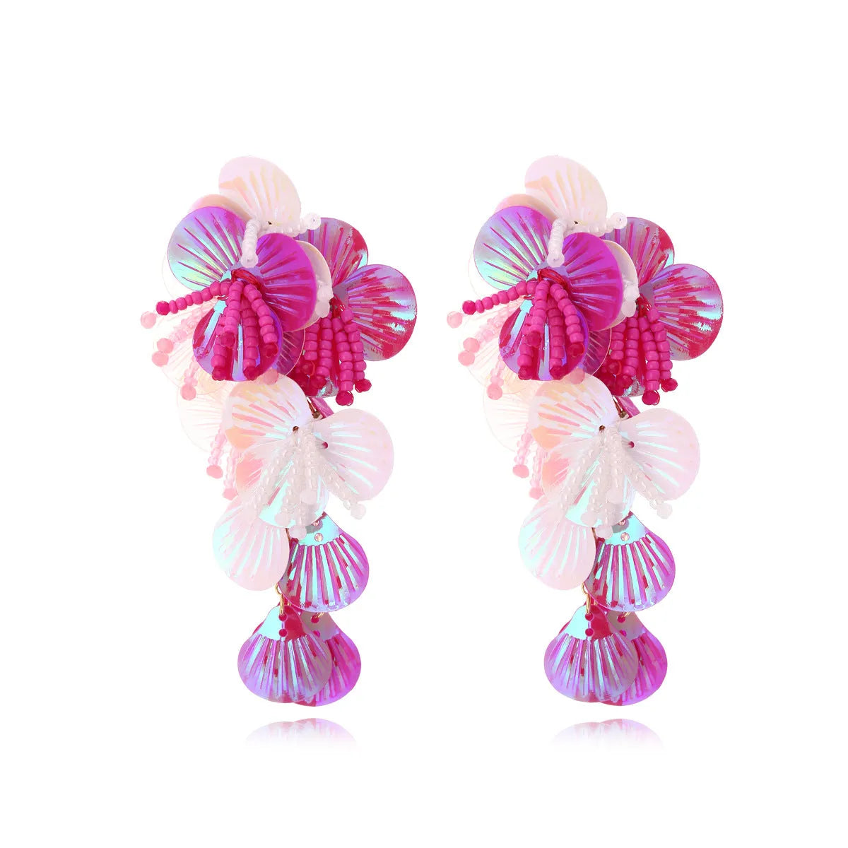 Handmade string bead flower earrings with exaggerated floral shapes in rose and purple colours, showing mixed materials and nickel-free hooks
