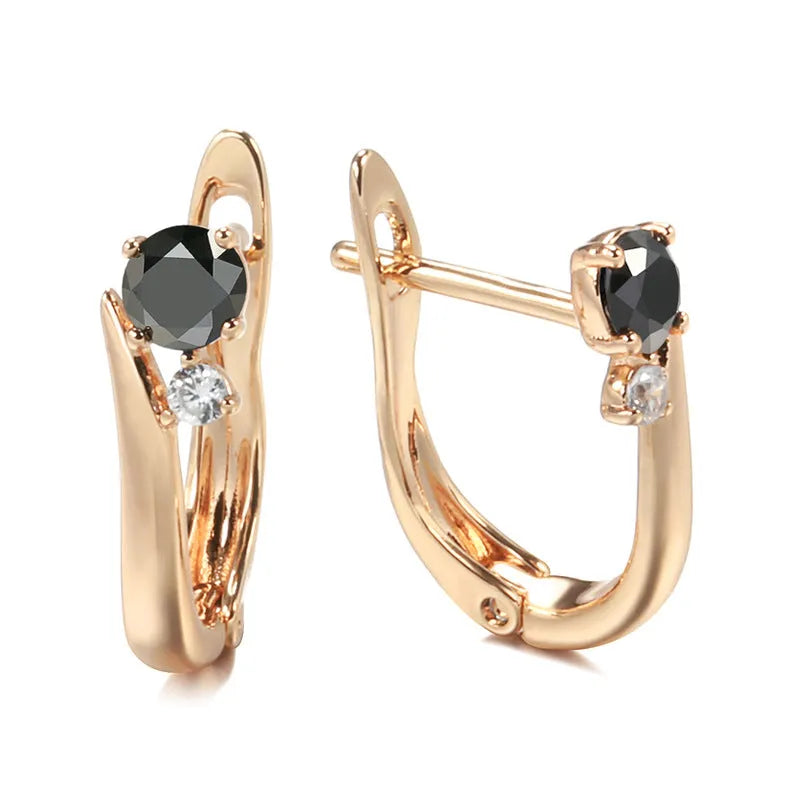 Gold-coloured women's drop earrings with black agate inlay in geometric design