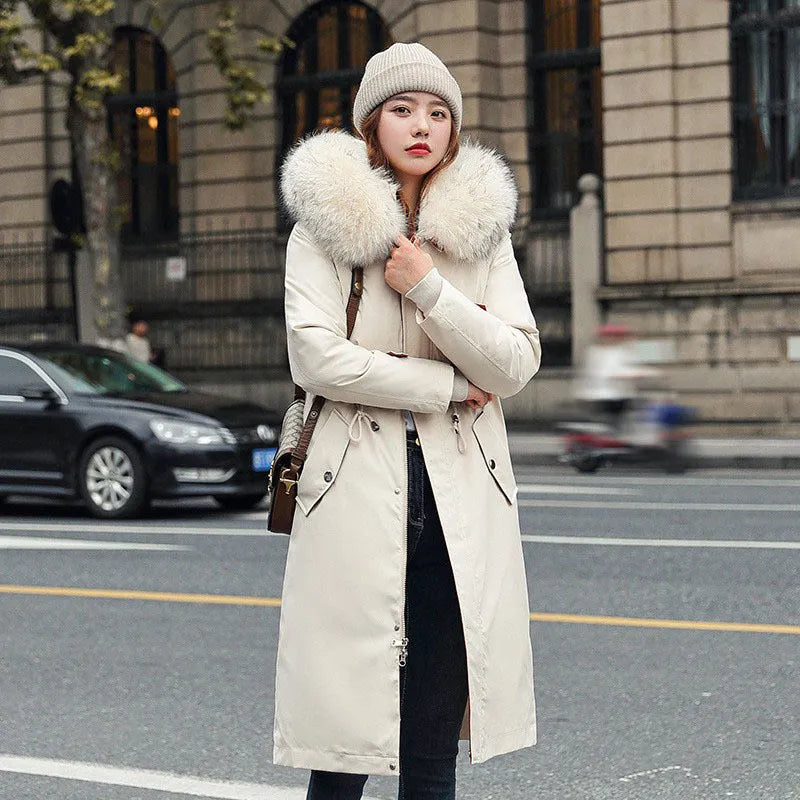 Women's long padded beige trench coat with a fleece lining, shown on a model.