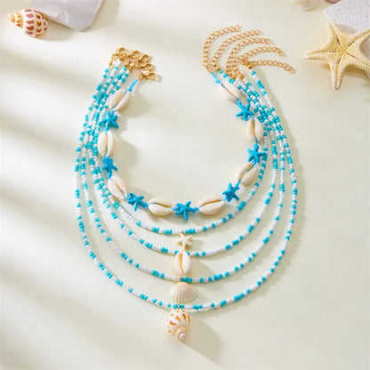 Five women's necklaces with starfish shell beads on adjustable chains in summer colours