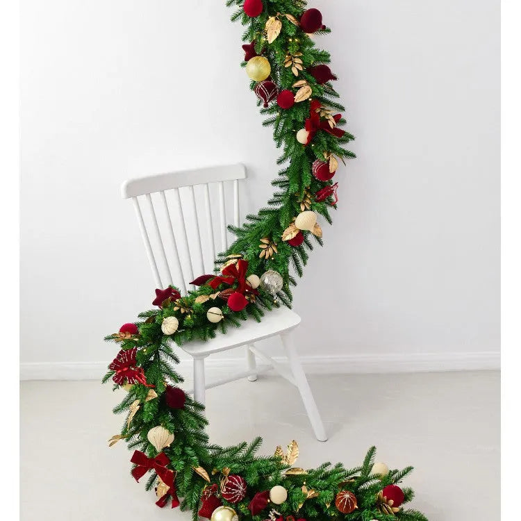 Long 2.7 metre Christmas PE rattan garland with velvet balls and integrated lights in golden leaf or red rattan colour.
