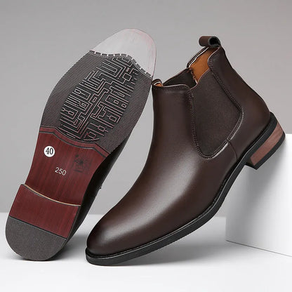 Men's black Chelsea boots with pointed toe design and sewing thread detailing on artificial PU upper