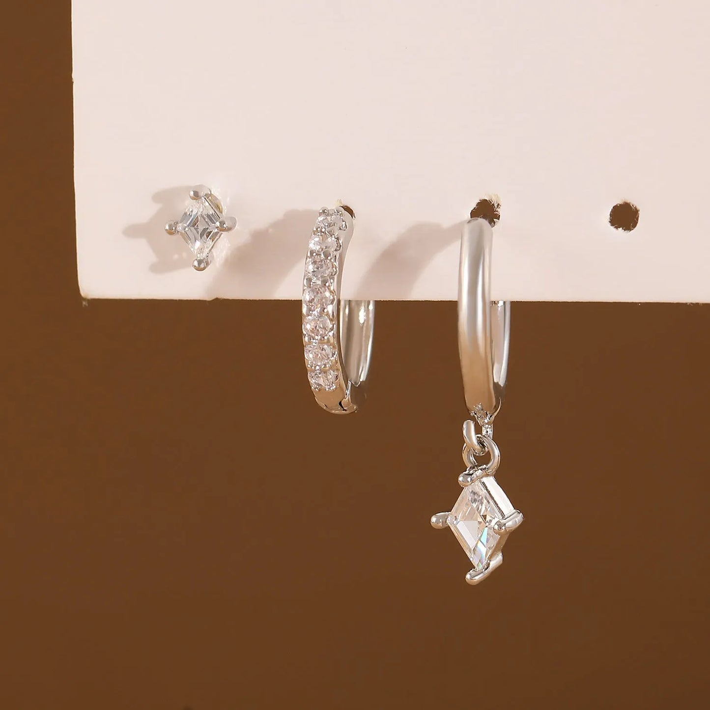Ladies three-piece geometric earring set with inlaid zircon in gold and white colours