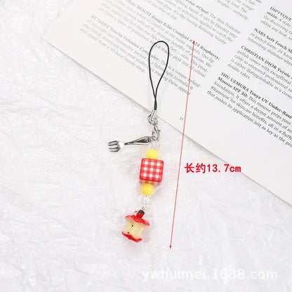 Plastic and resin fruit charm keychain with apple, strawberry designs on silver rope