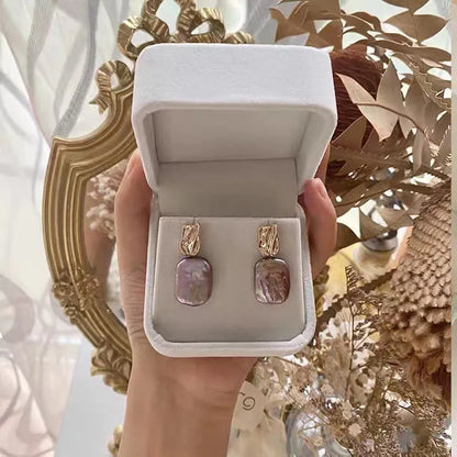 Geometric quadrilateral freshwater pearl stud earrings in purple, white or pink colours with alloy settings