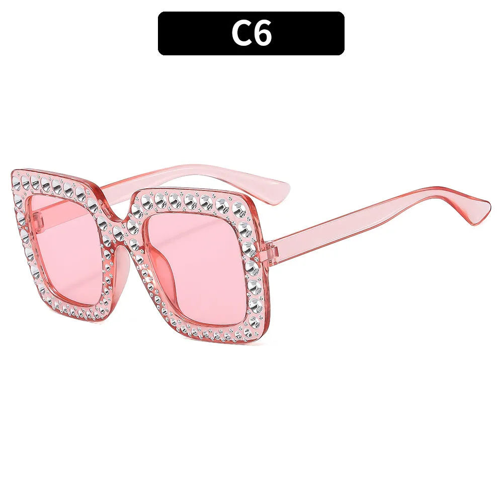Plastic sunglasses with fashion personality styling in various colour options including black frame and transparent tea frame
