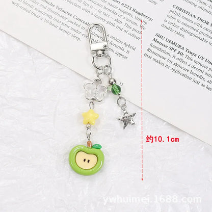 Plastic and resin fruit charm keychain with apple, strawberry designs on silver rope