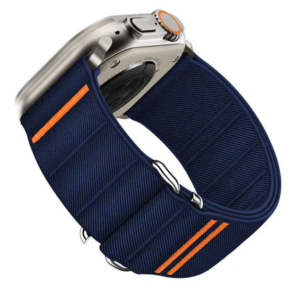 Elastic nylon Apple Watch band with stainless steel buckle shown in Army Green colour on a wrist.