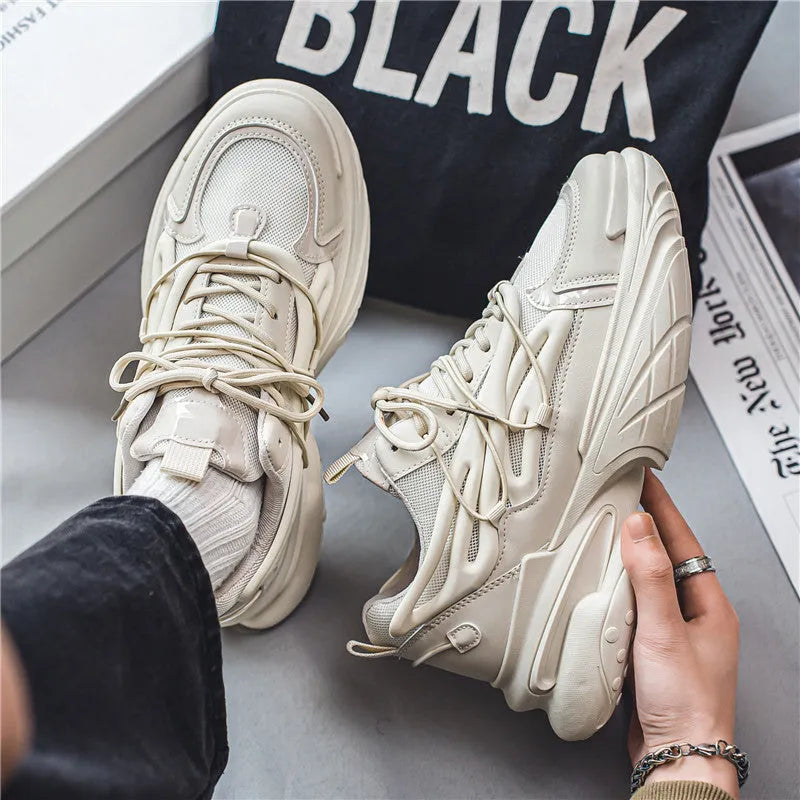 Men's low-top lace-up sneakers in mesh and PU leather with rubber sole, shown in beige and black colours.