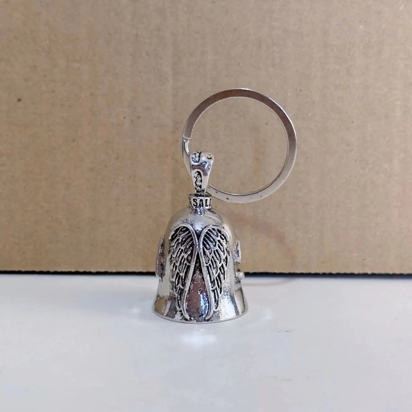 Vintage-style white angel wings necklace and matching keychain with electroplated alloy finish