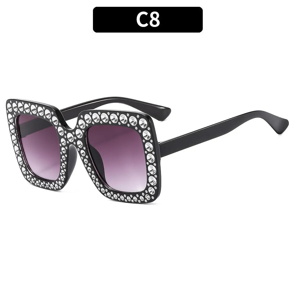 Plastic sunglasses with fashion personality styling in various colour options including black frame and transparent tea frame