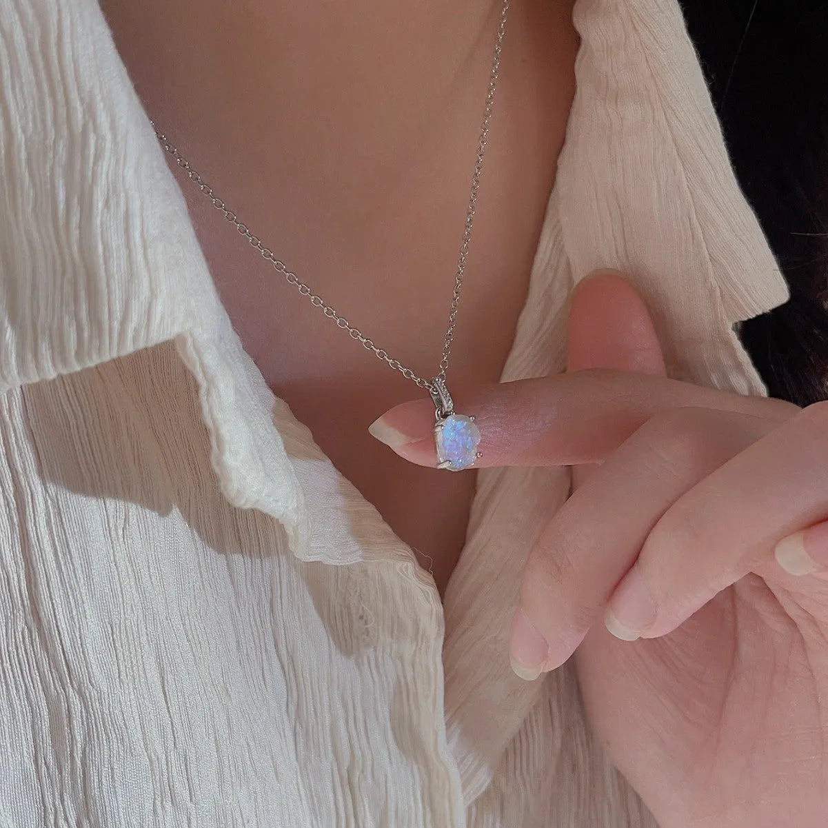 Geometric crystal moonstone pendant on an adjustable sterling silver necklace chain.