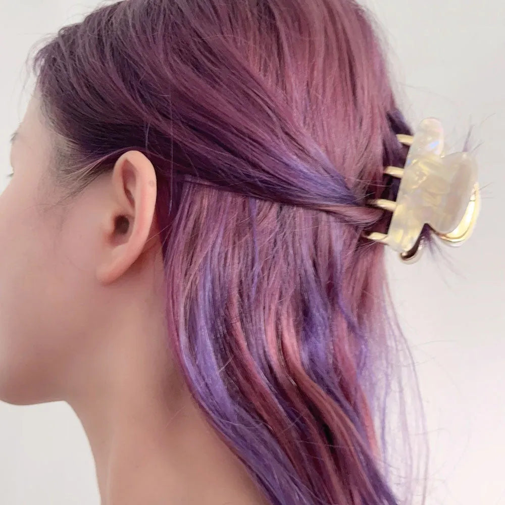 Acetate hair barrettes with metal alloy grip in leopard print, white, and ink colour options