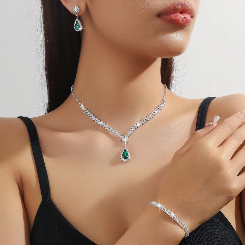 Rhinestone claw chain necklace and earrings jewellery set in water drop shape design available as two-piece or three-piece suites with matching bracelet in white, blue, red, green, or pink colours for women