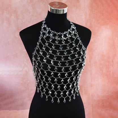 Clear acrylic crystal sequins body chain draped as a chest necklace.