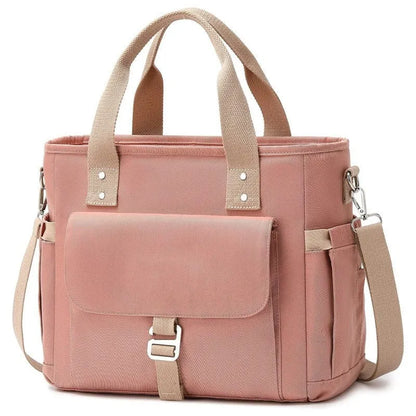 A pink cube-style Oxford cloth belt bag with a removable shoulder strap and a side pocket.