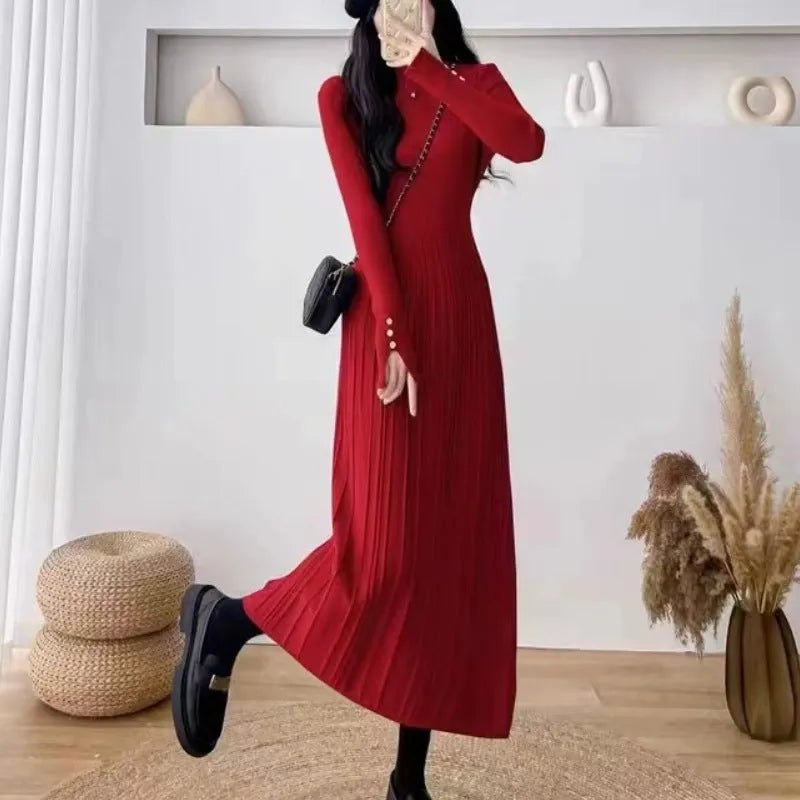 Women's beige high-waisted A-line pullover dress with a knitted texture, midi length.
