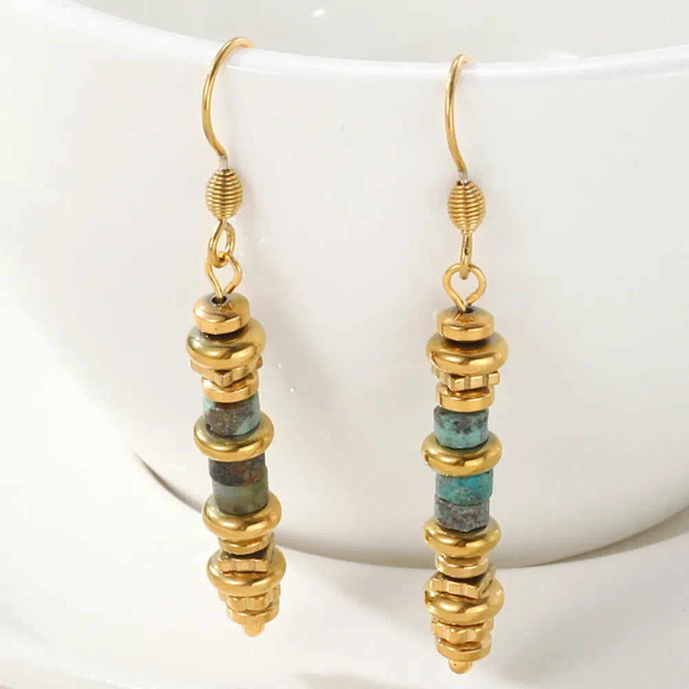 Geometric titanium steel dangle earrings with 18K gold plating on a white background.